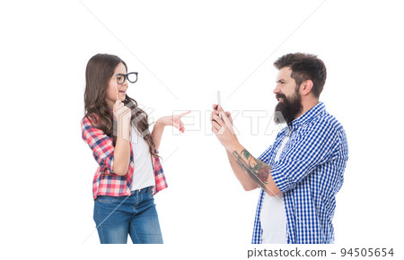Girl child daughter with prop glasses posing for bearded man father taking photo with phone, family Girl child daughter with prop glasses posing for bearded man father taking photo with phone, family 94505654