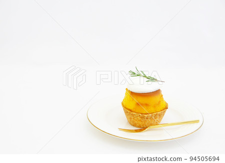 Pumpkin pudding tartlet on a white plate Pumpkin pudding tartlet on a white plate 94505694