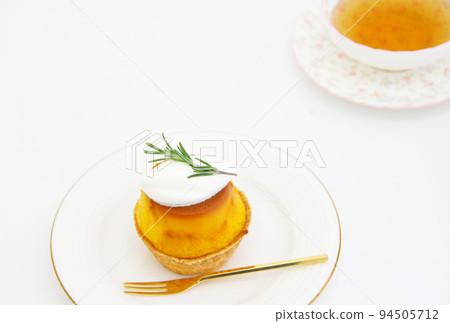 Pumpkin pudding tartlet on a white plate Pumpkin pudding tartlet on a white plate 94505712