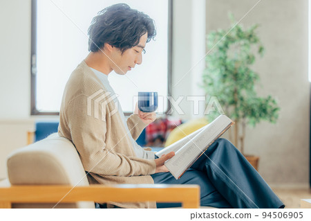 A man reading a book A man reading a book 94506905