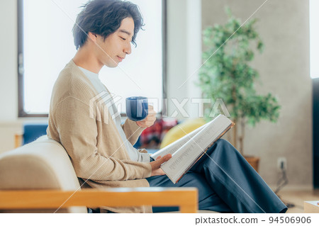 A man reading a book A man reading a book 94506906
