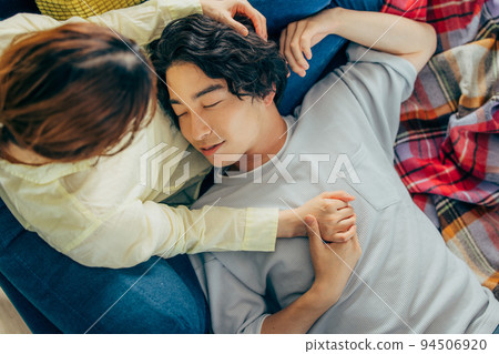couple lying in the living room couple lying in the living room 94506920