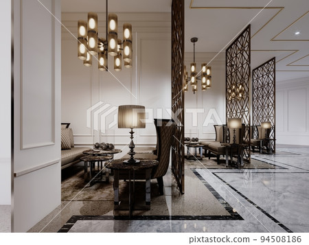 The hotel lobby with a seating waiting area with luxurious classic armchairs and a metal figured partition between the rooms. 94508186