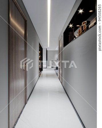 A long corridor in an apartment with gray walls and doors and a black niche with contemporary decor. A long corridor in an apartment with gray walls and doors and a black niche with contemporary decor. 94508265