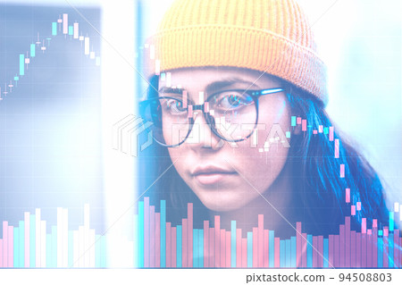 Investment and stock trading. Portrait of young woman trader looking at trading charts at computer monitor, reflection in eyeglasses. Double exposure. Concept of nft and cryptocurrencies Investment and stock trading. Portrait of young woman trader looking at trading charts at computer monitor, reflection in eyeglasses. Double exposure. Concept of nft and cryptocurrencies 94508803