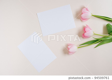 Beautiful composition spring flowers. Blank frame for text, pink tulips flowers on beige background. Valentine's Day, Easter, Birthday, Happy Women's Day. Flat lay, top view, copy space Beautiful composition spring flowers. Blank frame for text, pink tulips flowers on beige background. Valentine's Day, Easter, Birthday, Happy Women's Day. Flat lay, top view, copy space 94509761