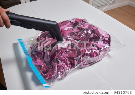 Space saver saving seal bag sucking air vacuum clothing storage compressed package. 94510798