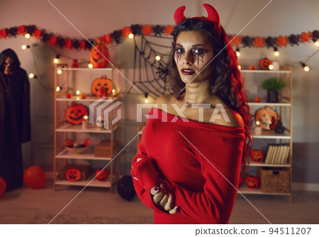 Portrait of woman in evil costume on Halloween celebration 94511207