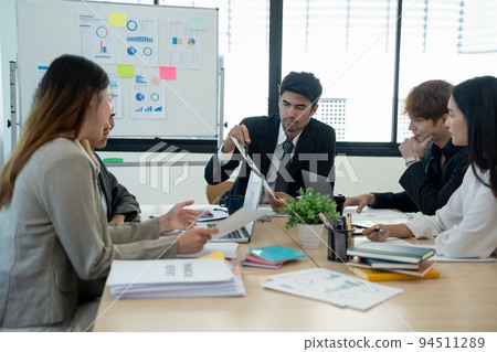 diverse business team people and female leader boss discuss financial result review paperwork share ideas brainstorm collaborate work in teamwork at group briefing table 94511289