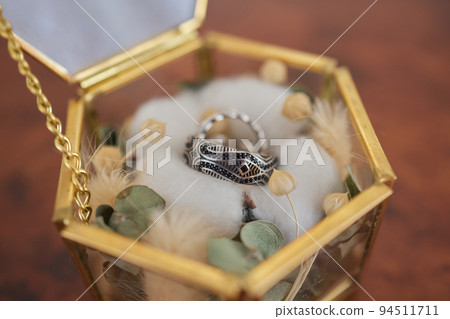 Wedding day, two rings on the small decorative pillow. 94511711