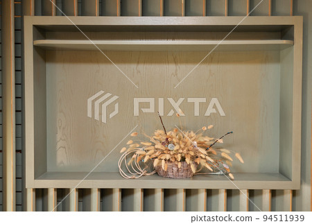 dried exotic flower Protea and shadow on beige paint textured background close up . poster. minimal floral concept. dried exotic flower Protea and shadow on beige paint textured background close up . poster. minimal floral concept. 94511939