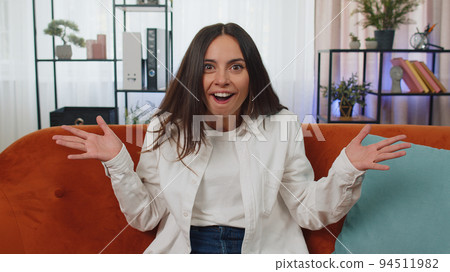 Excited young woman surprised, shocked by sudden victory, good win news, celebrating, wow reaction Excited young woman surprised, shocked by sudden victory, good win news, celebrating, wow reaction 94511982