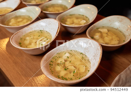 soup with dumplings, soup with sour cream, side view light background. soup with dumplings, soup with sour cream, side view light background. 94512449