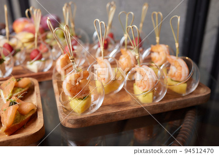 Gourmet appetizers: caviar, venison, tuna and salmon. 94512470