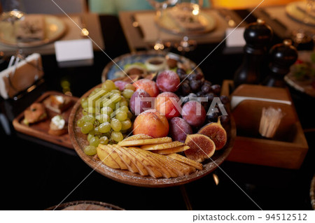 Salad and chopsticks on the table with many fruits, legumes and vegetables. Balanced feeding concept. 94512512