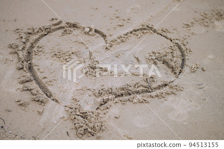 Love sign on sand. Love heart symbol in sand on tropical beach. Holidays Backgrounds Textures. Puri, Odisha, India 94513155