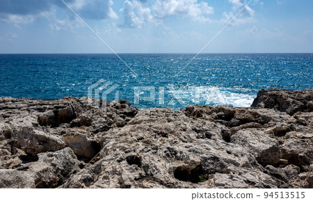Waves crash on the rocky shore of the Mediterranean Sea on the Akamas Peninsula in the northwest of the island of Cyprus. 94513515