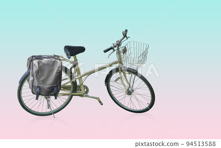 yellow and black body of bicycle with old and silver front basket, black handles and seat which is two tone color, on green and pink background, object, bike, speed, copy space 94513588