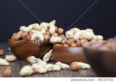 A pile of hazelnuts on the table 94514750