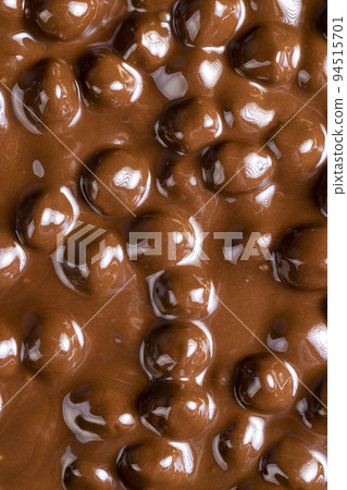 real milk chocolate while cooking with hazelnuts real milk chocolate while cooking with hazelnuts 94515701