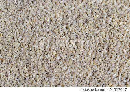 Fresh uncooked bulgur porridge on the table Fresh uncooked bulgur porridge on the table 94517047