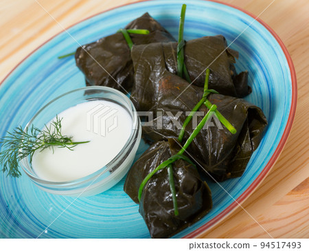 Stuffed grape leaves with assorted fillings Stuffed grape leaves with assorted fillings 94517493
