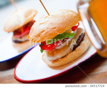 Beef burger served in cafe Beef burger served in cafe 94517724