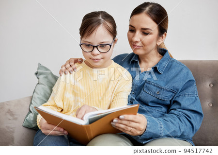 Mom And Daughter Reading Book 94517742