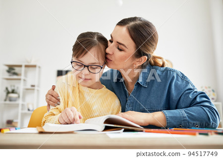 Girl With Down Syndrome In Homeschooling Lesson 94517749