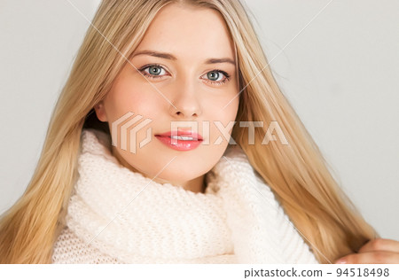 Autumn winter fashion and knitwear, beautiful woman wearing warm knitted scarf, close-up portrait 94518498