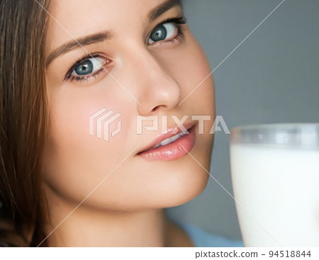 Diet and wellness, young woman with glass of milk or protein shake cocktail, portrait 94518844