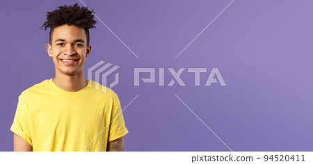 Close-up portrait of smiling, enthusiastic hispanic male student searching job, consider career opportunities, recruiting to company, smiling cheerful standing purple background 94520411