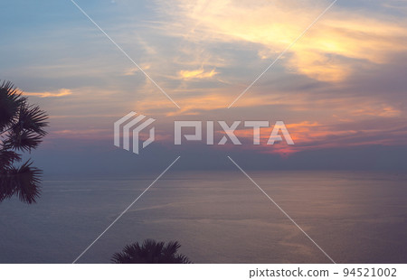 A bright, beautiful sunset overseas in the tropics A bright, beautiful sunset overseas in the tropics 94521002