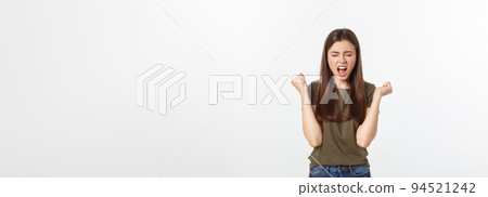 Girl with a suspicious look and hand on her side on a white isolated background. Girl with a suspicious look and hand on her side on a white isolated background. 94521242
