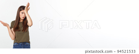 Girl with a suspicious look and hand on her side on a white isolated background. 94521533