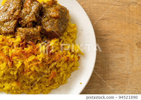 Beef Biryani or Curried rice and beef - Thai-Muslim version of Indian biryani, with fragrant yellow rice and beef 94521890