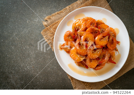 Sweet shrimps is Thai dish which cooks with fish sauce and sugar Sweet shrimps is Thai dish which cooks with fish sauce and sugar 94522264