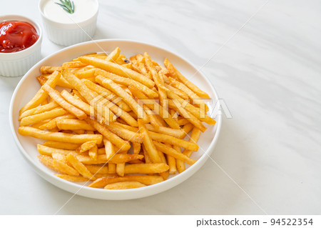 French fries with sour cream and ketchup French fries with sour cream and ketchup 94522354
