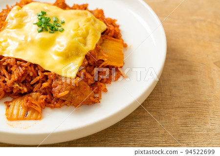 kimchi fried rice with pork and topped cheese kimchi fried rice with pork and topped cheese 94522699
