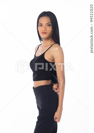 Half body tanned skin women with disability of young adult stand confident, white background. Asian female long straight hair smile in black shirt dress pant 94522820