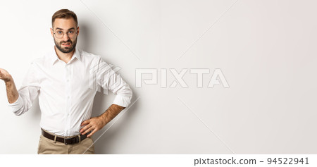 Confused office worker shrugging, cant understand something, standing over white background Confused office worker shrugging, cant understand something, standing over white background 94522941