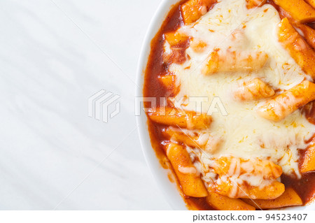 Korean rice cake in spicy Korean sauce with cheese, Cheese Tokpokki, Tteokbokki with Cheese Korean rice cake in spicy Korean sauce with cheese, Cheese Tokpokki, Tteokbokki with Cheese 94523407