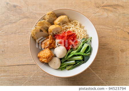 egg noodles with fish balls and shrimp balls in pink sauce, Yen Ta Four or Yen Ta Fo egg noodles with fish balls and shrimp balls in pink sauce, Yen Ta Four or Yen Ta Fo 94523794