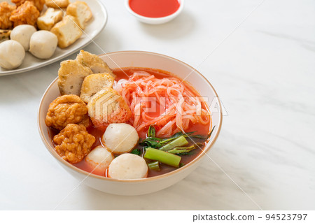 small flat rice noodles with fish balls and shrimp balls in pink soup, Yen Ta Four or Yen Ta Fo small flat rice noodles with fish balls and shrimp balls in pink soup, Yen Ta Four or Yen Ta Fo 94523797