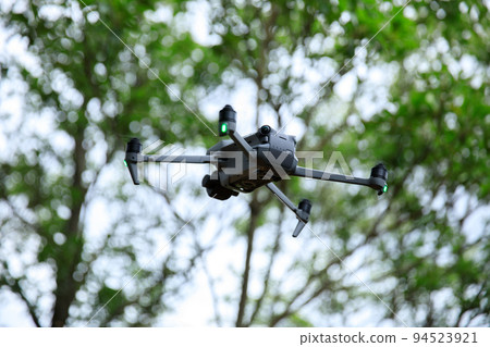 Flying drone in summer forest 94523921