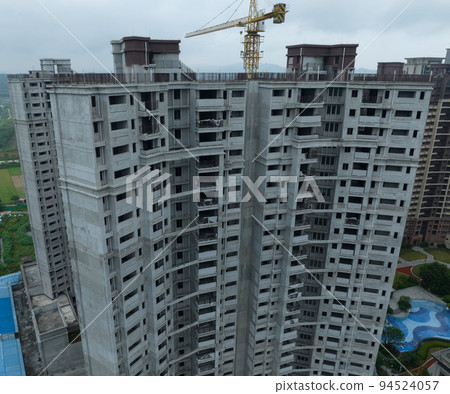 Aerial view of multistory apartment construction site in China Aerial view of multistory apartment construction site in China 94524057