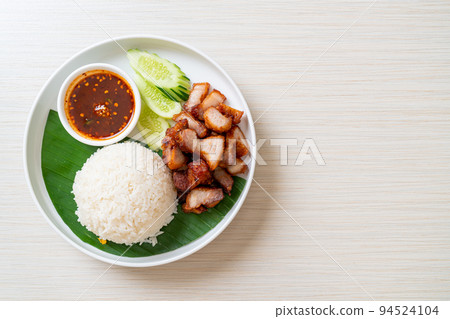 fried belly pork with rice with spicy sauce 94524104
