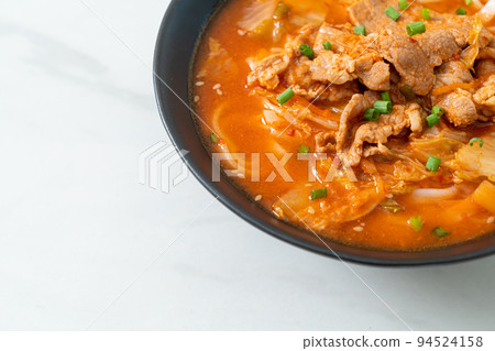 Korean udon ramen noodles with pork in kimchi soup Korean udon ramen noodles with pork in kimchi soup 94524158