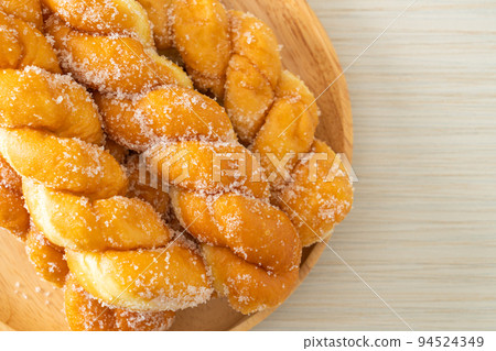 sugar doughnut in spiral shape 94524349