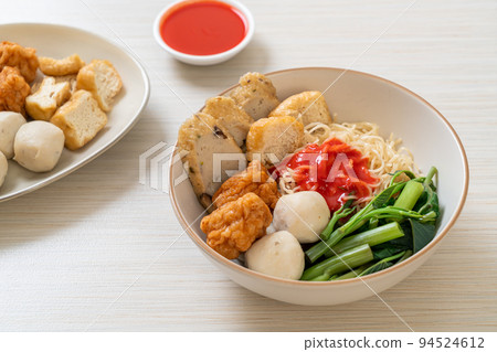 egg noodles with fish balls and shrimp balls in pink sauce, Yen Ta Four or Yen Ta Fo egg noodles with fish balls and shrimp balls in pink sauce, Yen Ta Four or Yen Ta Fo 94524612